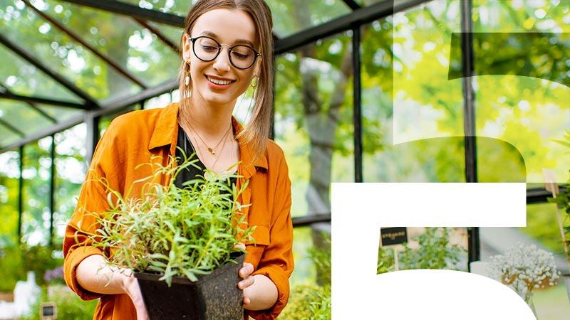 woman holding plant